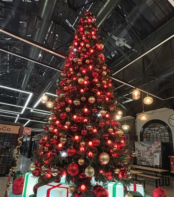 A 20-foot Christmas Tree with red decorations in the Cornhill Market.