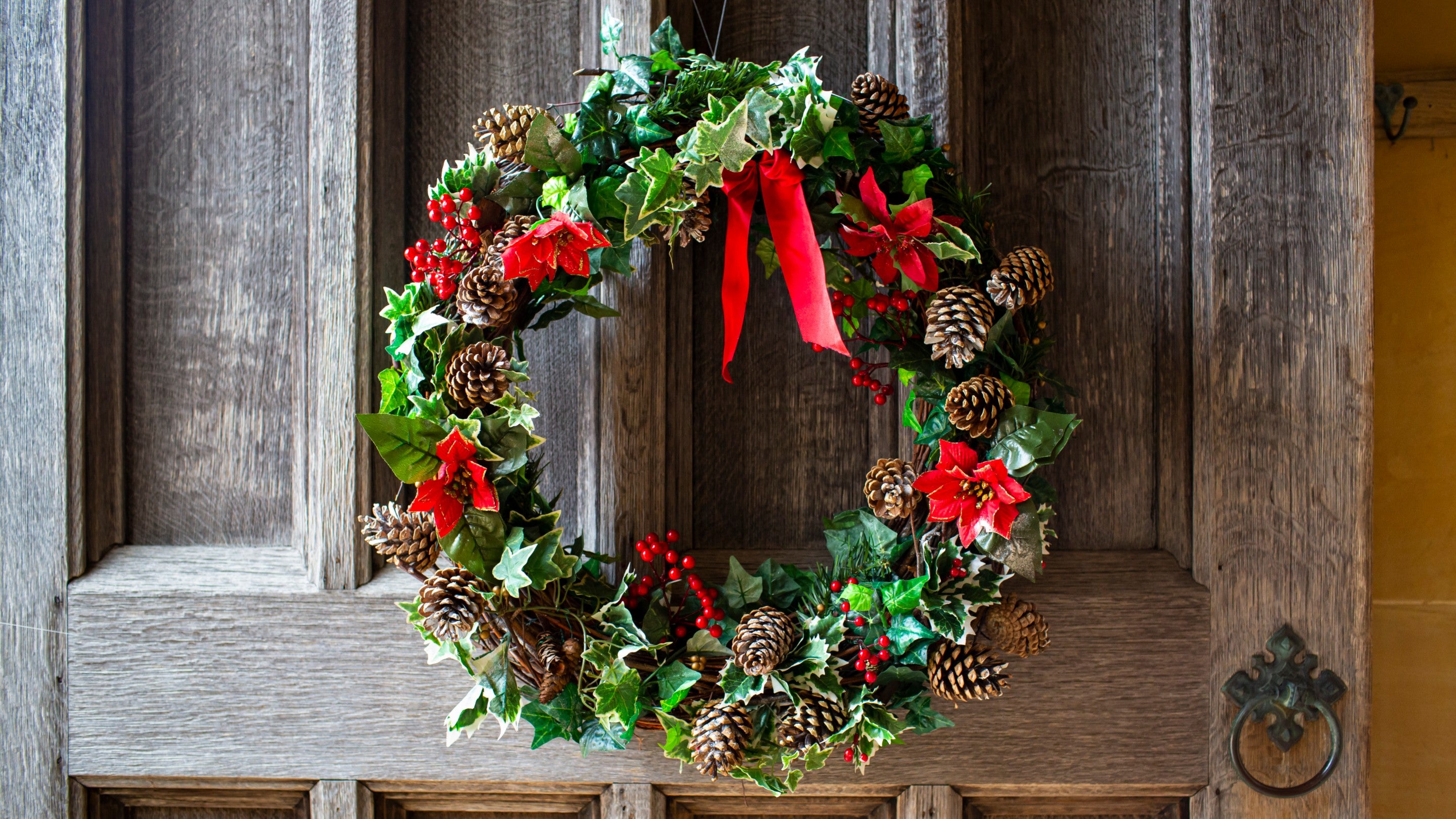 Festive wreath hanging on a door